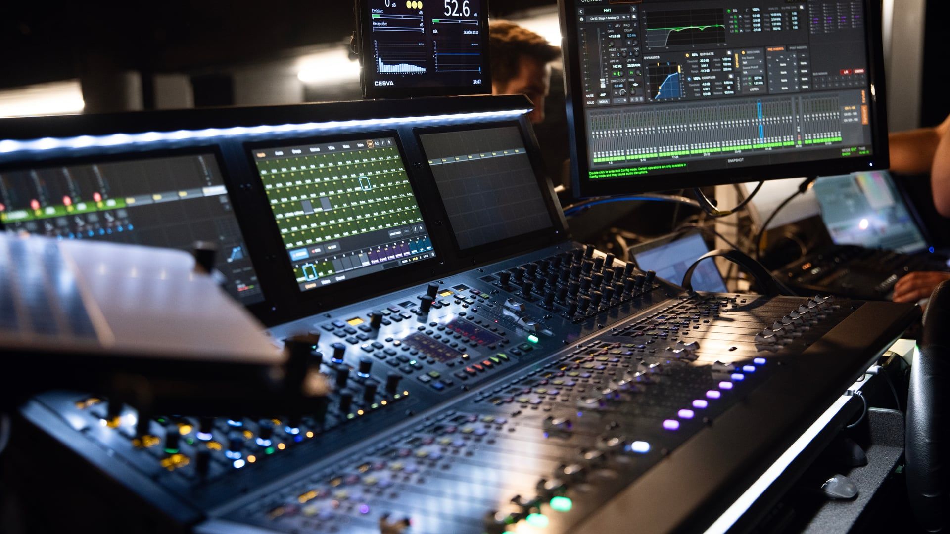 Professional audio setup with mixing consoles in theater